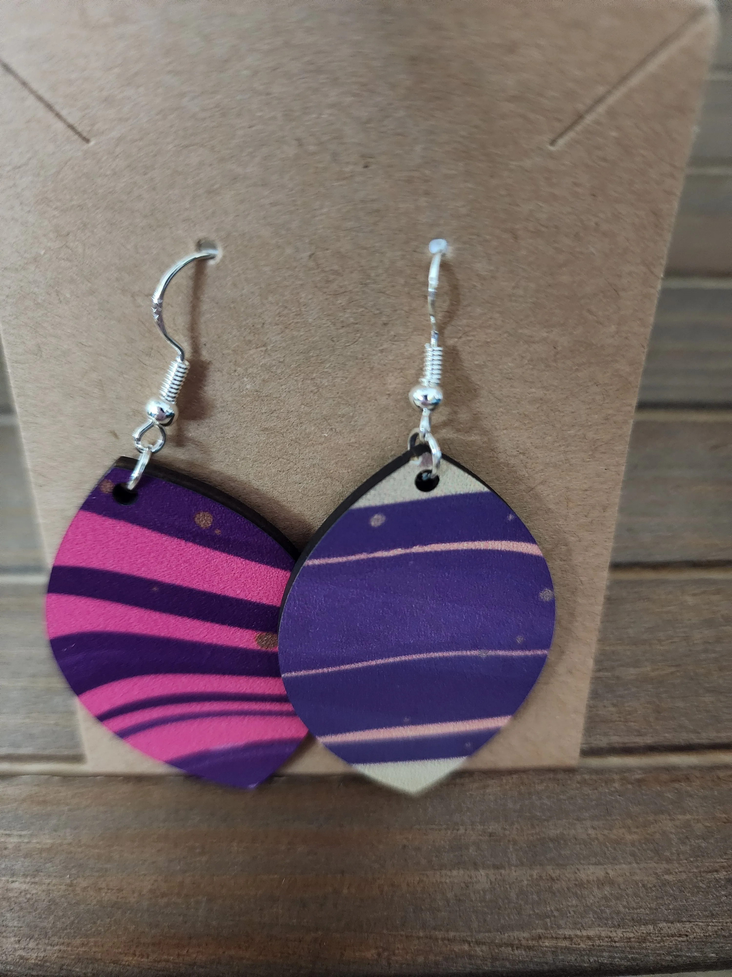 Playful purple design "football" shaped earrings